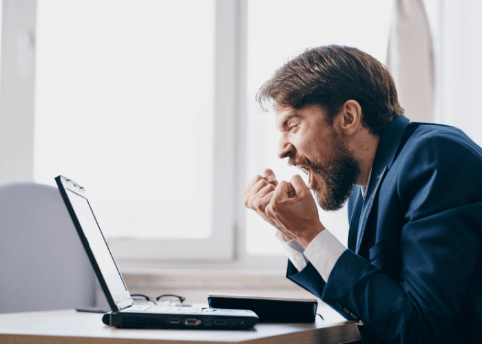 Angry businessman seeing a fake review